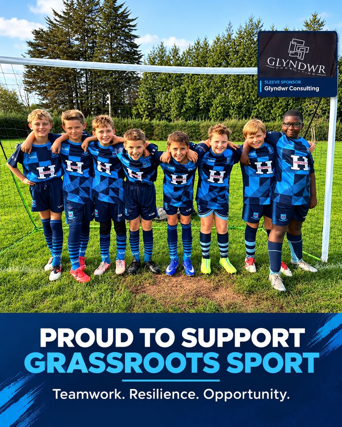 Marshfield Junior Football players in their kit, with a Proud to Support Grassroots Sport banner